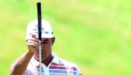 Rickie Fowler lines up his putt on the eighth green during the first round of the US Open golf tournament at Erin Hills.