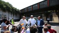 Mohammed Mahmoud (C), an Imam at Finsbury Park Mosque, gives a statement to the media at a police cordon in the Finsbury Park area of north London on June 19, 2017, following a vehicle attack on pedestrians. Ten people were injured when a van drove into a