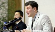 This file photo taken on February 29, 2016 and released by North Korea's official Korean Central News Agency (KCNA) on March 1, 2016 shows US student Otto Frederick Warmbier (R). / AFP.