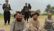 An image grab shows three Western hostages taken captive in northern Mali by the Qaida-linked Al-Din movement, appear in an undiscloed location in Mali: South African-Briton Stephen Malcolm McGown (C), Swede Johan Gustafsson (L) and Dutch national Sjaak R
