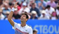 Serbia's Novak Djokovic celebrates victory over France's Gael Monfils during the men's final tennis match at the ATP Aegon International tennis tournament in Eastbourne, southern England, on July 1, 2017. Serbia's Novak Djokovic beat France's Gael Monfils