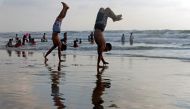 Palestinians spend time on a beach in a warm weather in Gaza City July 7, 2017. Reuters/Mohammed Salem