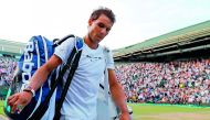 Spain's Rafael Nadal leaves the court after losing to Luxembourg's Gilles Muller on Monday.