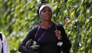 US player Venus Williams arrives to attend a practice session on the eleventh day of the 2017 Wimbledon Championships at The All England Lawn Tennis Club in Wimbledon, southwest London, on July 14, 2017, on the eve of her women's final match against Spain