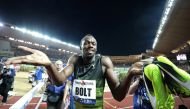 Jamaican sprinter Usain Bolt reacts after winning. REUTERS/Eric Gaillard