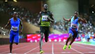 Jamaica’s Usain Bolt (centre) crosses the finish line to win the men’s 100m event at the IAAF Diamond League athletics meeting in Monaco on Friday. Bolt clocked a season’s best of 9.95 seconds.