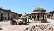 Workers clearing rubble from the courtyard of the ancient Great Umayyad Mosque in the old city, yesterday.
