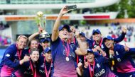 England players pose after winning the ICC Women’s World Cup final against India at Lord’s cricket ground in London, yesterday. 