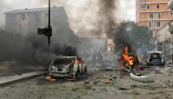 Vehicles burn at the scene of an explosion in Mogadishu, Somalia, July 30, 2017. REUTERS/Feisal Omar

