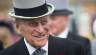 This file photo taken on May 16, 2017 shows Britain's Prince Philip, Duke of Edinburgh greets guests at a garden party at Buckingham Palace in London. (AFP / POOL / Victoria Jones)