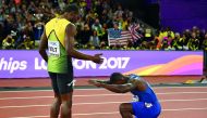 Justin Gatlin of the US bows to third placed Usain Bolt of Jamaica after winning the race.