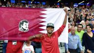 Qatar’s gravity-defying high jumper Mutaz Essa Barshim celebrates after winning the gold during the IAAF World Championships at the London Stadium in London, United Kingdom, yesterday. Barshim won the high jump gold with a winning leap of 2.35 metres to e