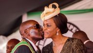 President Robert Mugabe kissing his wife and first lady Grace Mugabe during the country's 37th Independence Day celebrations at the National Sports Stadium in Harare on April 18, 2017. AFP / Jekesai Njikizana