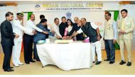 Ambassador P Kumaran (centre) along with other officials cutting a cake to mark the celebrations. Pic: Kammutty VP / The Peninsula