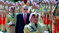 Turkish President Recep Tayyip Erdogan reviews the guard of honour at the Royal Palace in Amman, Jordan, yesterday.