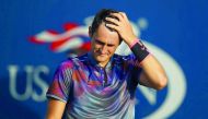 Bernard Tomic of Australia reacts during his 2017 US Open first round Men’s Singles match against Gilles Muller of Luxembourg on Monday. Tomic lost 3-6, 6-3, 6-4, 6-4.