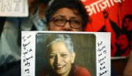 An protester holds a placard in a rally condemning the killing of journalist Gauri Lankesh, in Mumbai on September 6, 2017. AFP / Punit Paranjpe