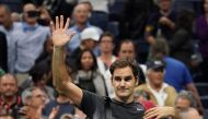 Roger Federer of Switzerland waves to the crowd after losing to Juan Martin del Potro of Argentina during their 2017 US Open Men's Singles quarter finals match at the USTA Billie Jean King National Tennis Center in New York on September 6, 2017. / AFP / D