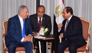 A handout released by the Egyptian Presidency shows Israeli Prime Minister Benjamin Netanyahu (L) meeting with Egyptian President Abdel Fattah al-Sisi in New YOrk on September 18, 2017, to discuss the Middle East peace process in their first public talks.