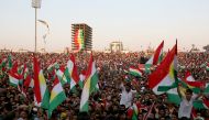 People gather to listen President of Iraqi Kurdish Regional Government (IKRG) Masoud Barzani's speech as they hold IKRG flags during a campaign ahead of next week's so-called referendum on regional independence in Erbil, Iraq on September 22, 2017.  Yunus