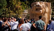 The General Directorate of Antiquities and Museums in Syria present the statue of the Lion of Al-Lat, which dates back to the first century AD, to the public after its restoration at the National Museum in Damascus on October 1, 2017.   AFP / LOUAI BESHAR