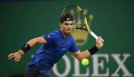 Rafael Nadal of Spain hits a return during his men's 2nd round singles match against Jared Donaldson of the US at the Shanghai Masters tennis tournament in Shanghai on October 11, 2017. / AFP / NICOLAS ASFOURI