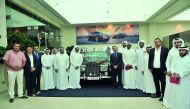 Abdul Hameed Al Siddiqi (last left), renowned Qatari artist  and senior officials of Rolls-Royce Motor Cars Doha, along with customers during the ‘Qatar Icon’ Art Exhibition which was held at the car showroom in The Pearl, yesterday. Pic Baher Amin/ The P