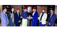Major General Salahedine Mehsud of Pakistan hands over a memento to Mubarak Al Boainin, member of Qatar Sports Press Committee during his visit to Pakistan.