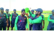 Imam-ul-Haq (left) receiving the Pakistan’s ODI cap from senior team-mate Muhammad Hafeez on Wednesday in Dubai.  