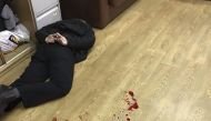 An intruder, who attacked anchor of Russian radio station Ekho Moskvy Tatyana Felgengauer, lies on the floor after he was detained at the station's office in Moscow, Russia October 23, 2017. Reuters/Vitaly Ruvinskiy

