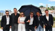 (FILES) This file photo taken on May 20, 2017 shows (from left) Swedish producer Erik Hemmendorff, Danish actor Claes Bang, US actress Elisabeth Moss, Swedish director Ruben Ostlund, Danish actor Christopher Laesso, and British actor Dominic West posing d
