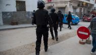 Moroccan police search for protestors from the Morocco's al-Hirak al-Shaabi movement on October 28, 2017 in Al Hoceima in the troubled northern Rif region, to mark the anniversary of the death of fishmonger Mouhcine Fikri, who was crushed to death a year 