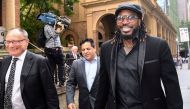 West Indies cricketer Chris Gayle reacts as he leaves the New South Wales Supreme Court after winning a defamation case against an Australian media company in Sydney, Australia, October 30, 2017. AAP/Brendan Esposito/via REUTERS