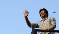 A file photo of  Bollywood actor Shah Rukh Khan seen waving to his fans during celebrations for his 52nd birthday at his home in Mumbai on November 2, 2017. / AFP / Sujit Jaiswal