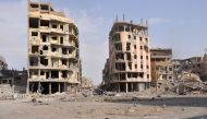 A general view shows damaged buildings in the eastern Syrian city of Deir Ezzor on November 4, 2017.   AFP