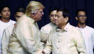 U.S. President Donald Trump shakes hands with Philippines President Rodrigo Duterte during the gala dinner marking ASEAN's 50th anniversary in Manila, Philippines, November 12, 2017. Reuters/Athit Perawongmetha