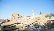 A collapsed house is seen, after a 7.3 magnitude earthquake hit northern Iraq, in Derbendihan district of Sulaymaniyah, Iraq on November 12, 2017. / ( Yunus Kele? - Anadolu Agency ).