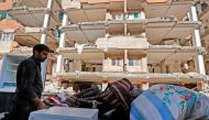 Iranians salvage their furniture and household appliances as they bring them outside the damaged buildings in the town of Sarpol-e Zahab in the western Kermanshah province near the border with Iraq, on November 15, 2017, following a 7.3-magnitude earthqua