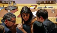U.S. Ambassador to the United Nations Nikki Haley speaks with a member of her team following a U.N. Security Council meeting on a bid to renew an international inquiry into chemical weapons attacks in Syria, at the United Nations headquarters in New York,