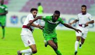 Al Ahli’s Mashel Abdulla (foreground) takes the ball past Al Markhiya’s Salih Mohamed during their QSL match at Al Arabi Stadium yesterday. Pic: Kammutty VP/The Peninsula