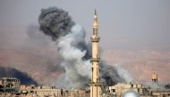 Smoke rises following an air strike on the rebel-held besieged town of Arbin, in the Eastern Ghouta region on the outskirts of Damascus, on November 18, 2017. / AFP / Amer ALMOHIBANY
