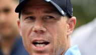 (FILES) This file photo taken on October 24, 2017 shows Australia's cricket team batsman David Warner speaking at a press conference in Sydney. AFP / SAEED KHAN