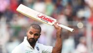 India's cricketer Shikhar Dhawan acknowledges the crowd after loosing his wicket during the fourth day of the first Test between India and Sri Lanka at the Eden Gardens cricket stadium in Kolkata on November 19, 2017. GETTYOUT / AFP / Dibyangshu SARKAR