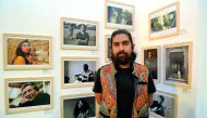 Pakistani photojournalist Mobeen Ansari with some of his works at the “Beautiful Pakistan, Amazing Qatar” photography exhibition which also features works by Qatari artist Haya Al  Thani, at Ezdan Mall yesterday.  Pic: Abdul Basit / The Peninsula