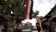 People walk along a street at Sarouja neighborhood in Damascus, Syria, November 26, 2017. REUTERS/Omar Sanadiki