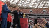 (FILES) This file photo taken on September 09, 2017 shows FIFA President Gianni Infantino (L) and Russian President Vladimir Putin (R) smiling during the opening of the trophy tour ceremony at Luzhniki stadium in Moscow.  AFP / SPUTNIK / Alexey DRUZHININ 