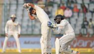 Indian batsman and team cptain Virat Kohli watches the ball after he plays a shot during the first day of the third Test cricket match between India and Sri Lanka at the Feroz Shah Kotla Cricket Stadium in New Delhi on December 2, 2017. (AFP / SAJJAD HUSS