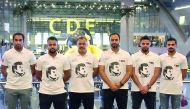 Qatari aquabike riders Waleed Mahmoud Al Sharshani and Ali Mohammed Al Nuaimi pose for a photograph with team officials prior to their departure for Thailand at the Hamad International Airport yesterday.