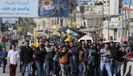 RAMALLAH, WEST BANK: Palestinian protesters march during their demonstration against U.S. President Donald Trump's recognition of Jerusalem as Israel's capital, near Qalandia checkpoint in West Bank between Jerusalem and Ramallah on December 8, 2017. (?ss