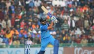 Indian cricket batsman and team captain Rohit Sharma plays a shot during the second One Day International (ODI) cricket match between India and Sri Lanka at The Punjab Cricket Association Stadium in Mohali on December 13, 2017. (AFP / SAJJAD HUSSAIN )